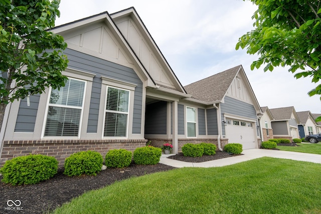 9741 Haughton Ln, Mccordsville, IN 46055 - view of front of home featuring brick siding, a front yard, driveway, board and batten siding, and a garage