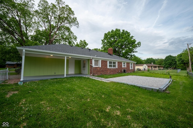 3457 W 58th St, Indianapolis, IN 46228 - back of house with a chimney, a patio, and brick siding
