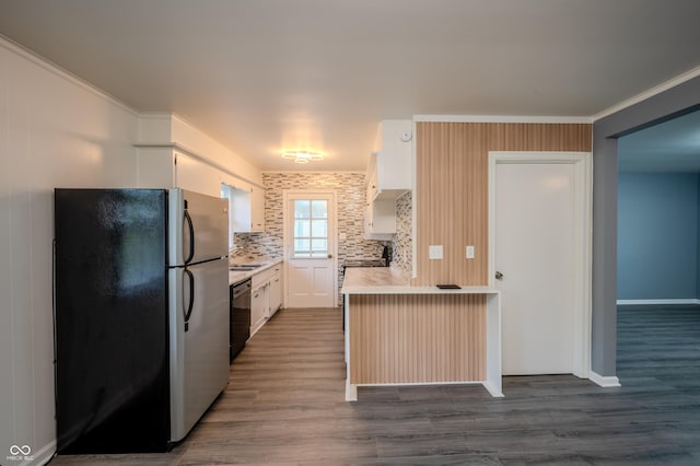 3457 W 58th St, Indianapolis, IN 46228 - kitchen with freestanding refrigerator, light countertops, dark wood-style flooring, dishwasher, and a sink
