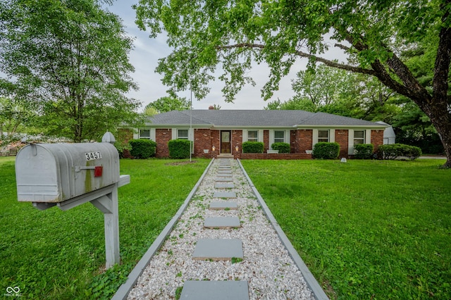 3457 W 58th St, Indianapolis, IN 46228 - ranch-style home featuring brick siding and a front lawn