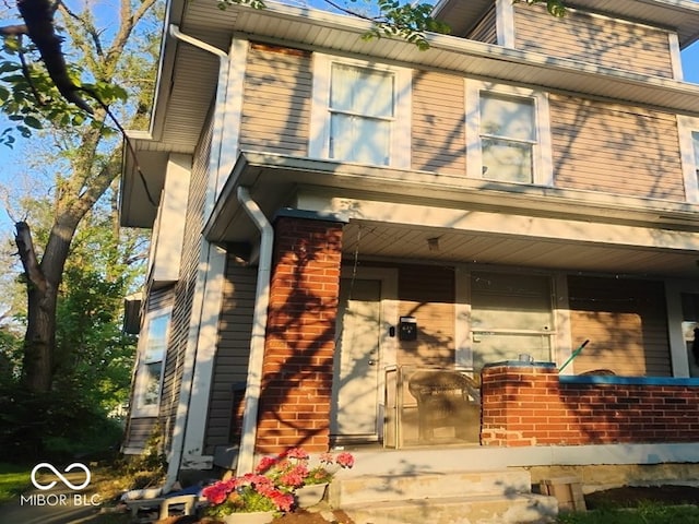 639 N Hamilton Ave, Indianapolis, IN 46201 - view of front of house featuring a porch and brick siding