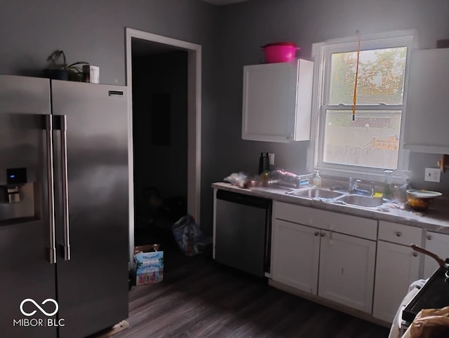 639 N Hamilton Ave, Indianapolis, IN 46201 - kitchen with high quality fridge, a sink, dishwasher, white cabinets, and dark wood-style flooring