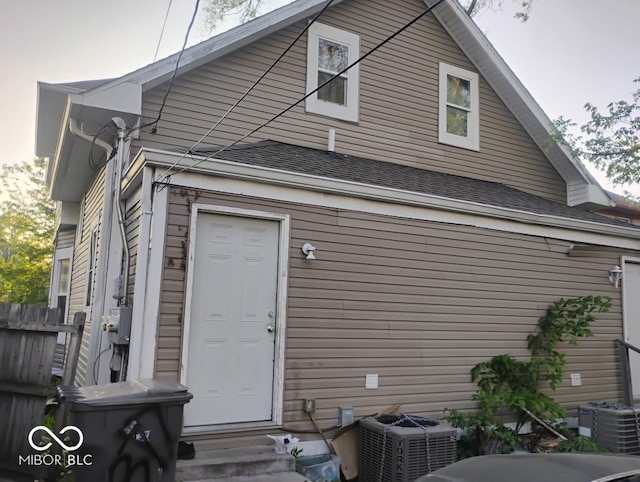 639 N Hamilton Ave, Indianapolis, IN 46201 - back of house with entry steps, central AC, and a shingled roof