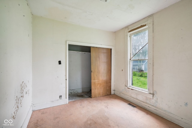 1514 W 2nd St, Marion, IN 46952 - unfurnished bedroom with a closet and concrete flooring