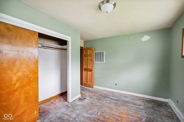 1514 W 2nd St, Marion, IN 46952 - unfurnished bedroom with a closet, baseboards, and wood finished floors