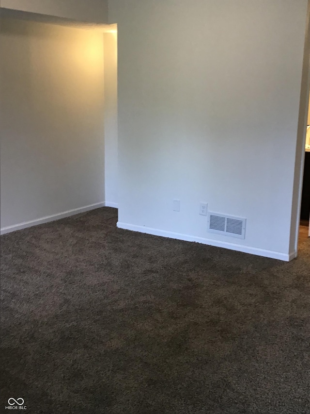 6070 Southbay Dr, Indianapolis, IN 46250 - spare room featuring dark carpet and baseboards