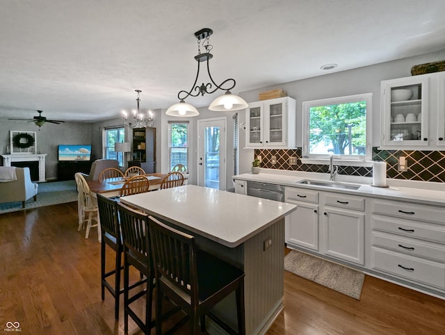 319 Mcintosh Ln, Westfield, IN 46074 - kitchen featuring a sink, stainless steel dishwasher, ceiling fan, a center island, and light countertops