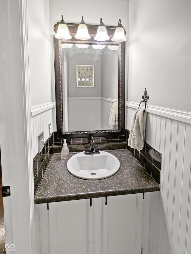 319 Mcintosh Ln, Westfield, IN 46074 - bathroom with vanity, a wainscoted wall, and a decorative wall