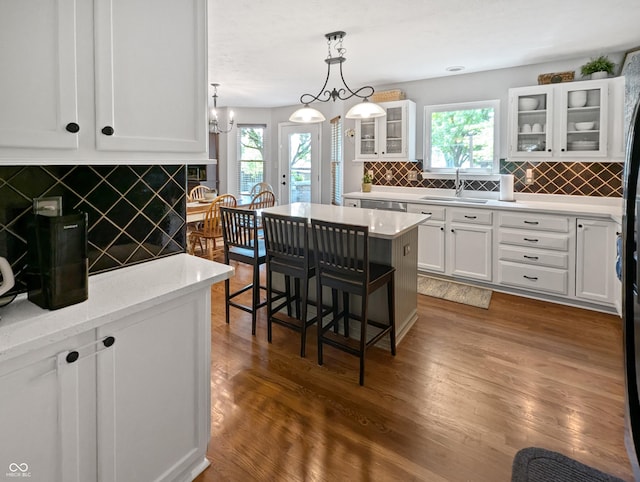 319 Mcintosh Ln, Westfield, IN 46074 - kitchen featuring a sink, white cabinets, healthy amount of natural light, and decorative backsplash