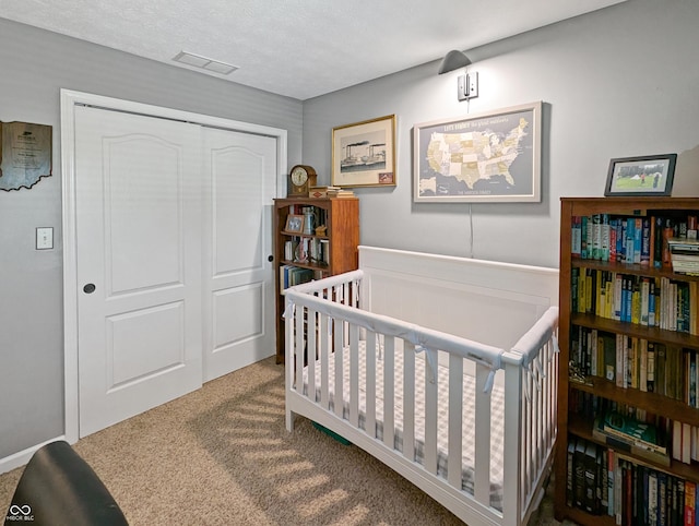 319 Mcintosh Ln, Westfield, IN 46074 - bedroom featuring a closet, carpet, and a nursery area