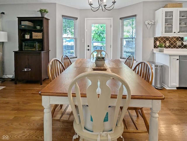 319 Mcintosh Ln, Westfield, IN 46074 - dining space with light wood finished floors and a chandelier