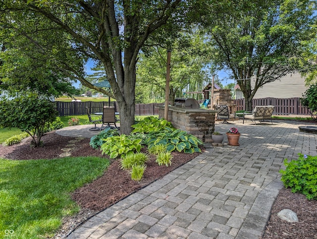 319 Mcintosh Ln, Westfield, IN 46074 - fenced backyard featuring a playground and a patio