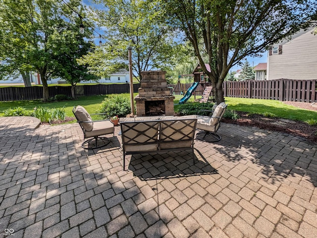 319 Mcintosh Ln, Westfield, IN 46074 - view of patio / terrace featuring an outdoor stone fireplace and a playground