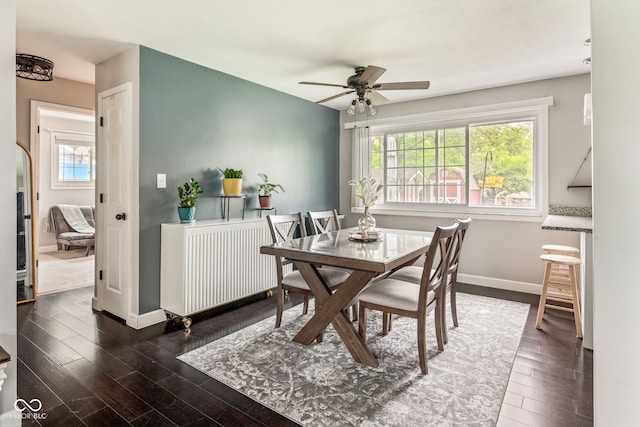 800 E 104th St, Carmel, IN 46280 - dining room featuring healthy amount of natural light, wood finished floors, a ceiling fan, and baseboards