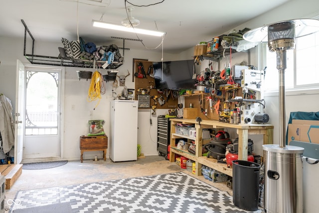 800 E 104th St, Carmel, IN 46280 - garage featuring a workshop area and fridge