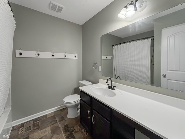 1843 Winchester Blvd, Avon, IN 46123 - full bath featuring stone finish floors, baseboards, toilet, vanity, and a shower with shower curtain