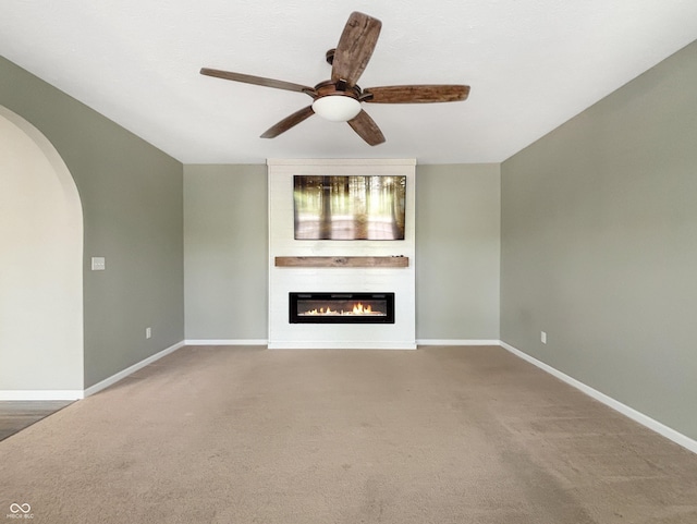 1843 Winchester Blvd, Avon, IN 46123 - unfurnished living room with a fireplace, a ceiling fan, arched walkways, and carpet