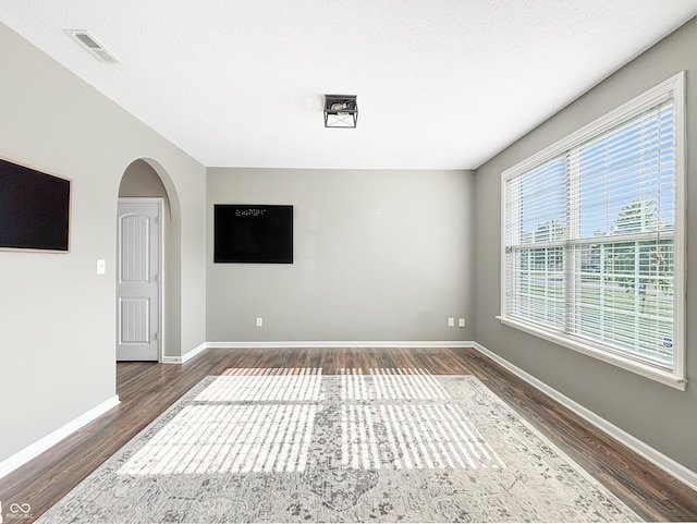 1843 Winchester Blvd, Avon, IN 46123 - unfurnished room with wood finished floors, baseboards, and arched walkways