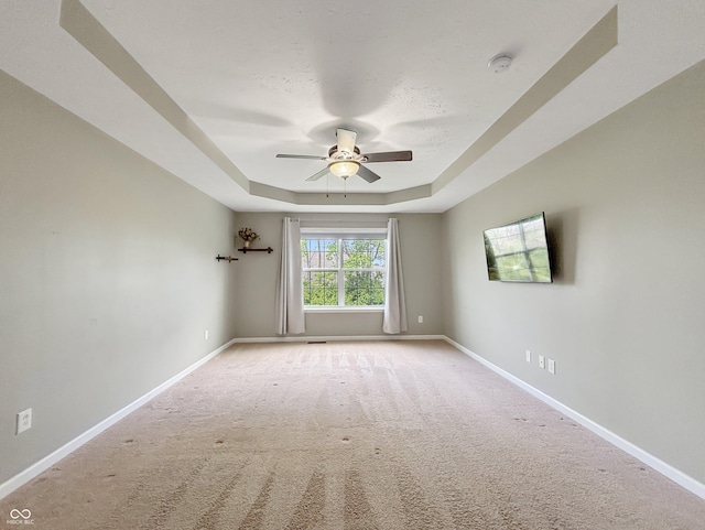 1843 Winchester Blvd, Avon, IN 46123 - empty room featuring a raised ceiling, ceiling fan, baseboards, and carpet