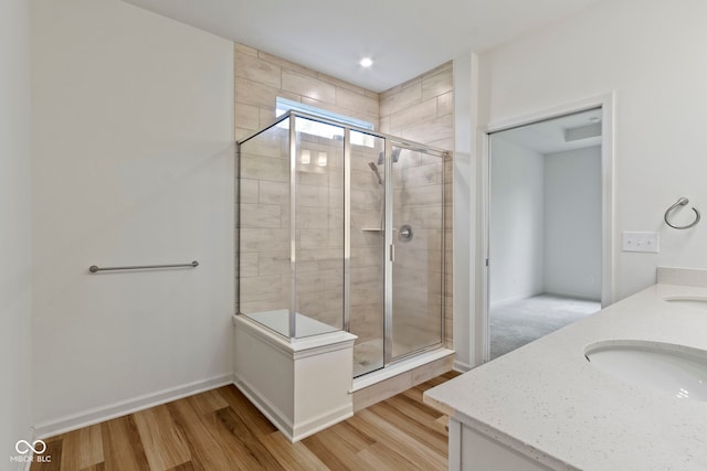 7248 Covington St, Lebanon, IN 46052 - full bath featuring a shower stall, wood finished floors, and double vanity