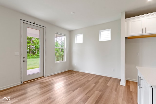 7248 Covington St, Lebanon, IN 46052 - unfurnished dining area featuring light wood-type flooring and baseboards