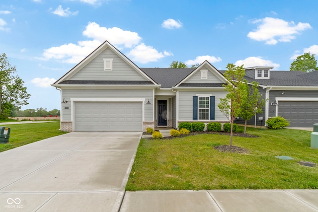 7248 Covington St, Lebanon, IN 46052 - view of front of property with driveway, a front lawn, brick siding, and an attached garage