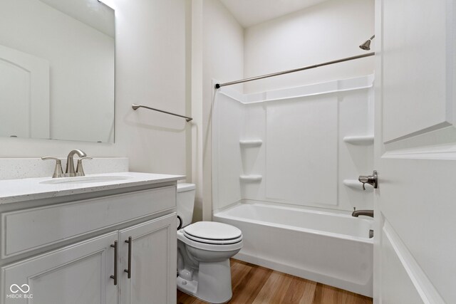 7248 Covington St, Lebanon, IN 46052 - bathroom with vanity, bathing tub / shower combination, toilet, and wood finished floors