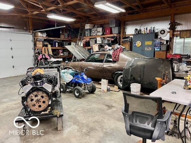 6774 S Becks Grove Rd, Freetown, IN 47235 - garage featuring a workshop area