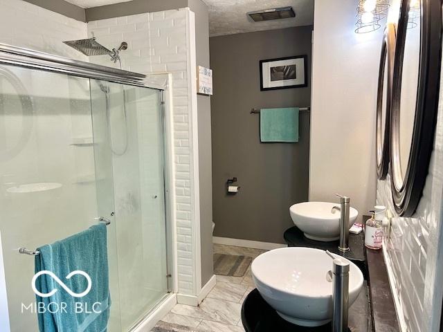6774 S Becks Grove Rd, Freetown, IN 47235 - full bathroom with a shower stall and baseboards