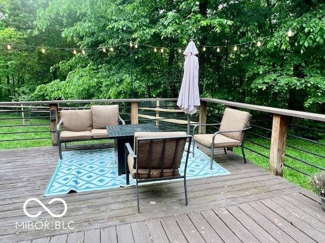 6774 S Becks Grove Rd, Freetown, IN 47235 - deck with an outdoor hangout area