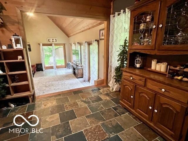 6774 S Becks Grove Rd, Freetown, IN 47235 - foyer entrance featuring vaulted ceiling and dark stone finish flooring