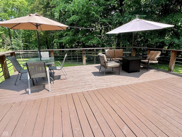 6774 S Becks Grove Rd, Freetown, IN 47235 - deck featuring outdoor dining space, an outdoor living space, and view of scattered trees