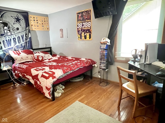 6774 S Becks Grove Rd, Freetown, IN 47235 - bedroom featuring wood finished floors and baseboards