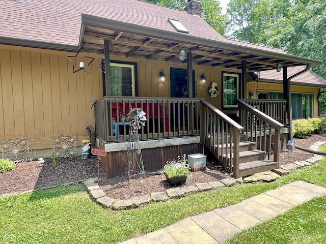 6774 S Becks Grove Rd, Freetown, IN 47235 - view of exterior entry with a shingled roof, a chimney, and a porch