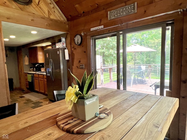 6774 S Becks Grove Rd, Freetown, IN 47235 - dining area with wooden walls and vaulted ceiling