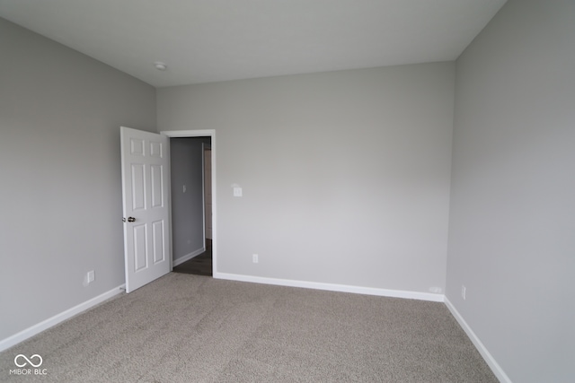 4250 Ironclad Dr, Bargersville, IN 46106 - carpeted spare room featuring baseboards and a smoke detector
