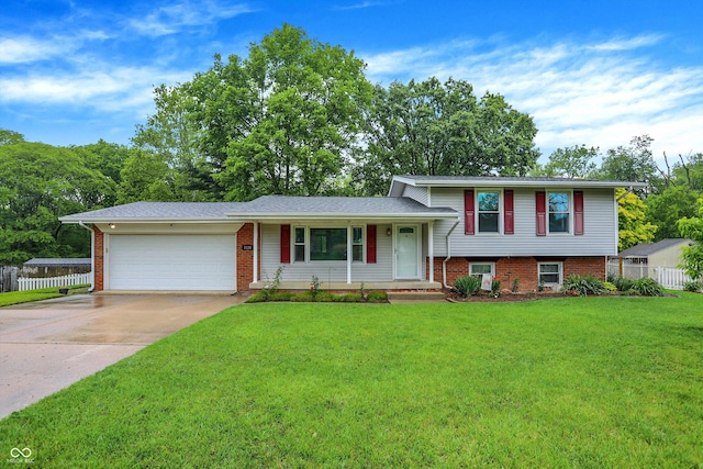3126 Carriage Rd, West Lafayette, IN 47906 - split level home with a porch, a garage, driveway, and brick siding