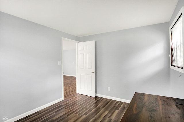 3126 Carriage Rd, West Lafayette, IN 47906 - unfurnished room with dark wood-style floors and baseboards