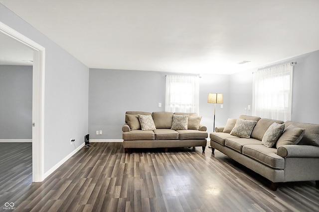 3126 Carriage Rd, West Lafayette, IN 47906 - living room with healthy amount of natural light, dark wood-style floors, and baseboards