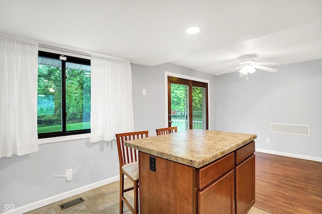 3126 Carriage Rd, West Lafayette, IN 47906 - kitchen featuring baseboards, plenty of natural light, a center island, a kitchen bar, and recessed lighting