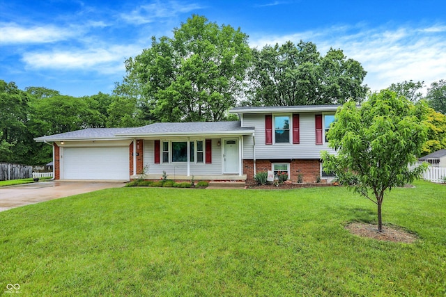 3126 Carriage Rd, West Lafayette, IN 47906 - tri-level home featuring a garage, brick siding, and concrete driveway