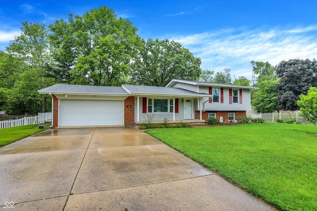 3126 Carriage Rd, West Lafayette, IN 47906 - split level home featuring brick siding, an attached garage, driveway, and covered porch