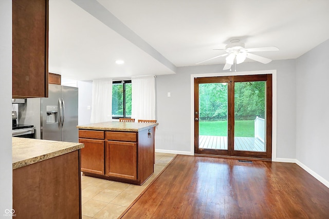 3126 Carriage Rd, West Lafayette, IN 47906 - kitchen with stainless steel appliances, light countertops, baseboards, and a ceiling fan