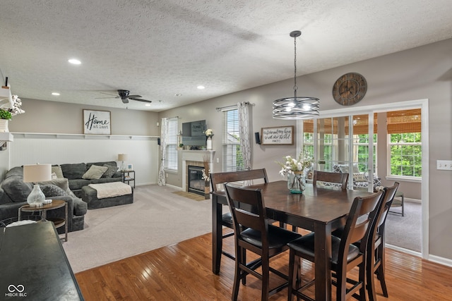 9756 Brook Meadow Dr, Mccordsville, IN 46055 - dining area with a textured ceiling, a ceiling fan, recessed lighting, baseboards, and wood finished floors