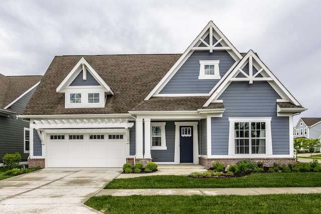 15596 Edenvale Dr, Westfield, IN 46074 - craftsman inspired home with concrete driveway, brick siding, and a shingled roof