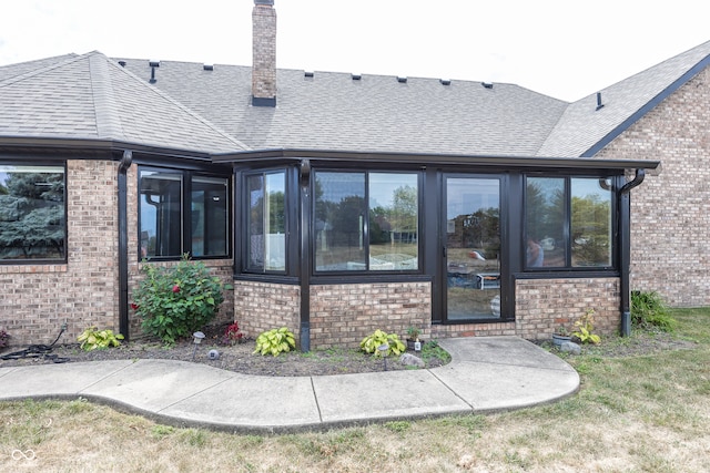 28 Patriot Ct, Greenfield, IN 46140 - back of property with brick siding, a chimney, and a shingled roof