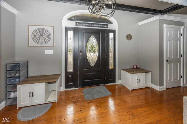 28 Patriot Ct, Greenfield, IN 46140 - entrance foyer with crown molding, light wood-style floors, baseboards, and a chandelier