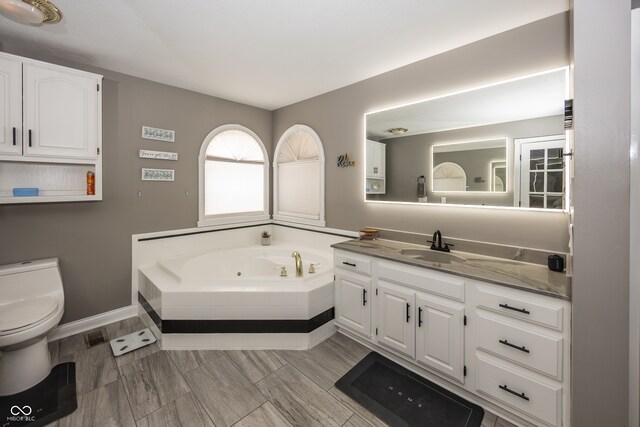 28 Patriot Ct, Greenfield, IN 46140 - full bath with a jetted tub, vanity, and toilet