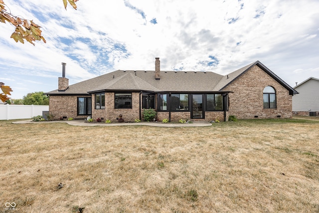 28 Patriot Ct, Greenfield, IN 46140 - rear view of property with a chimney, brick siding, a sunroom, and cooling unit