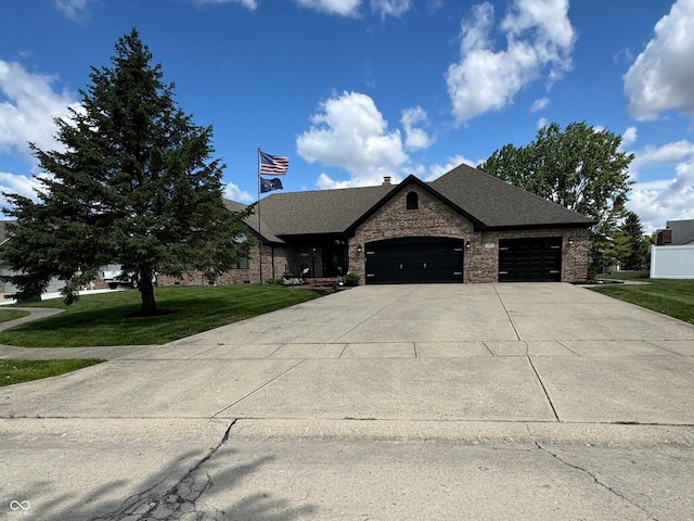 28 Patriot Ct, Greenfield, IN 46140 - view of front of house with a garage, concrete driveway, a front yard, and roof with shingles